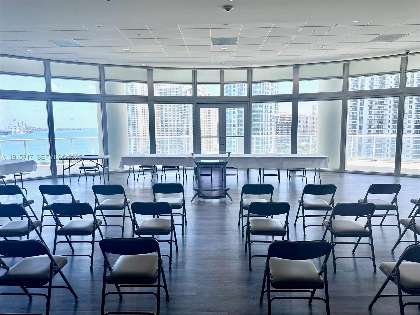 300 South Biscayne Boulevard, Unit T2407 Miami, FL 33131 - Photo 39 of 49 a dining room with furniture and large windows