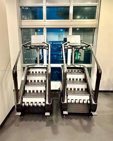 a lobby with furniture and floor to ceiling window