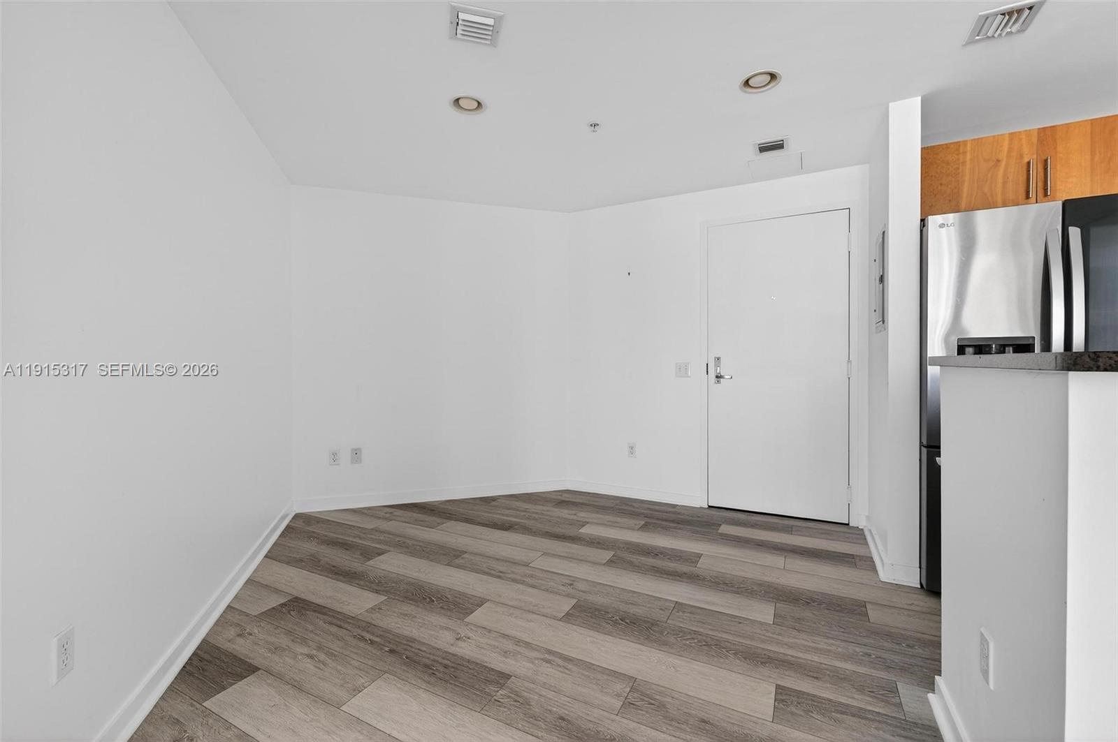 300 South Biscayne Boulevard, Unit T2407 Miami, FL 33131 - Photo 9 of 39 a view of a room with wooden floor and cabinet