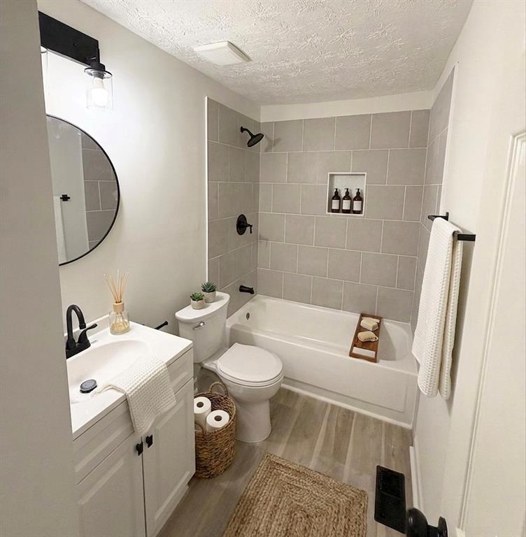 6855 Kimberly Mill Road Atlanta, GA 30349 - Photo 10 of 11 a bathroom with a toilet sink and mirror