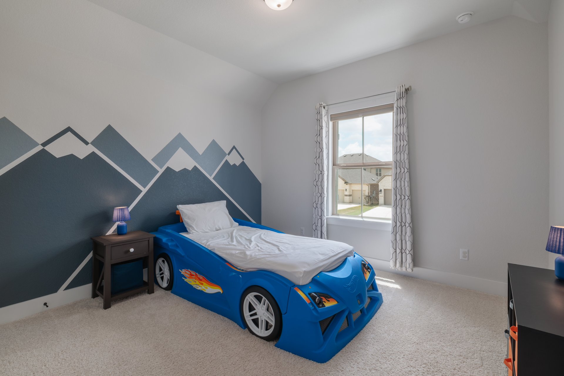 317 Autumn Oak Way Georgetown, TX 78628 - Photo 32 of 40 a bedroom with a bed and a car