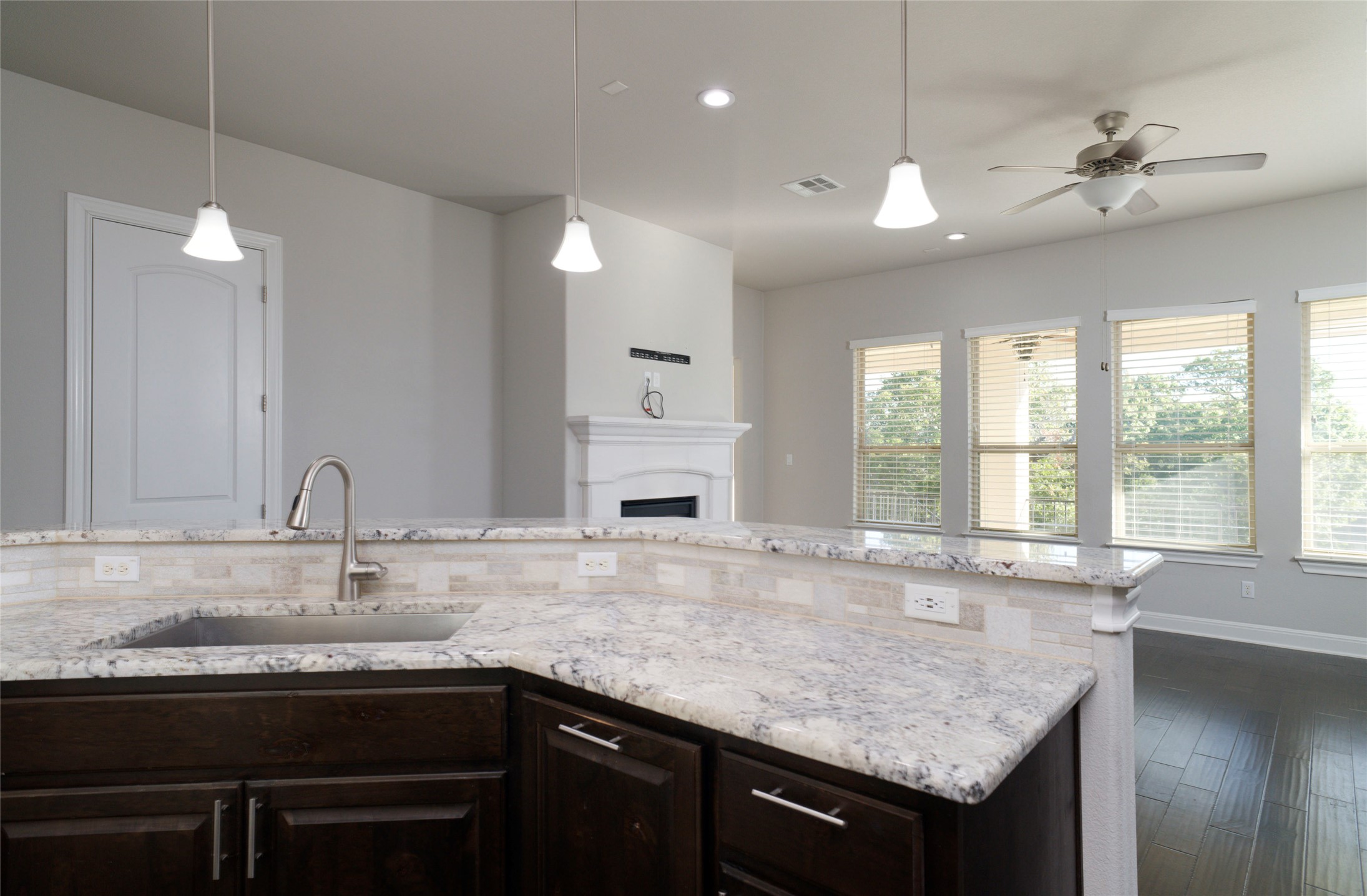 4001 Goodnight Trail Leander, TX 78641 - Photo 14 of 35 a bathroom with a granite countertop sink a large window and a chandelier