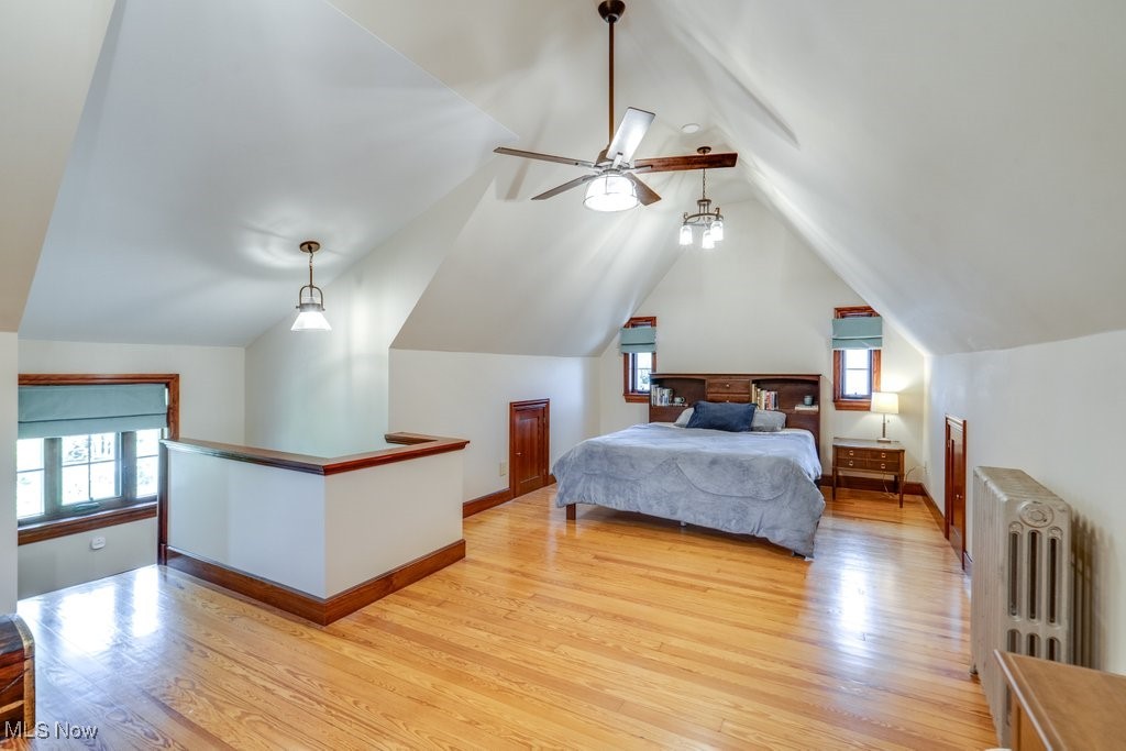 3849 Faversham Road Cleveland, OH 44118 - Photo 32 of 44 Bedroom with light wood-style floors, radiator, vaulted ceiling, and a ceiling fan