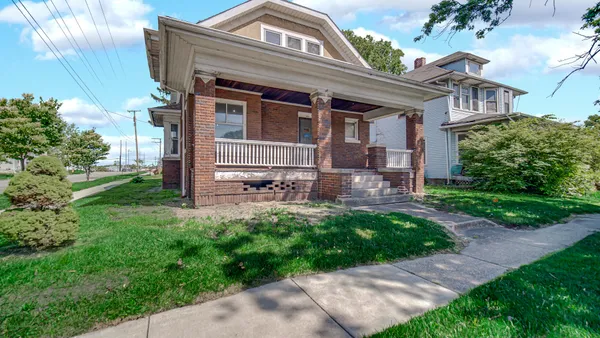 a front view of a house with a yard