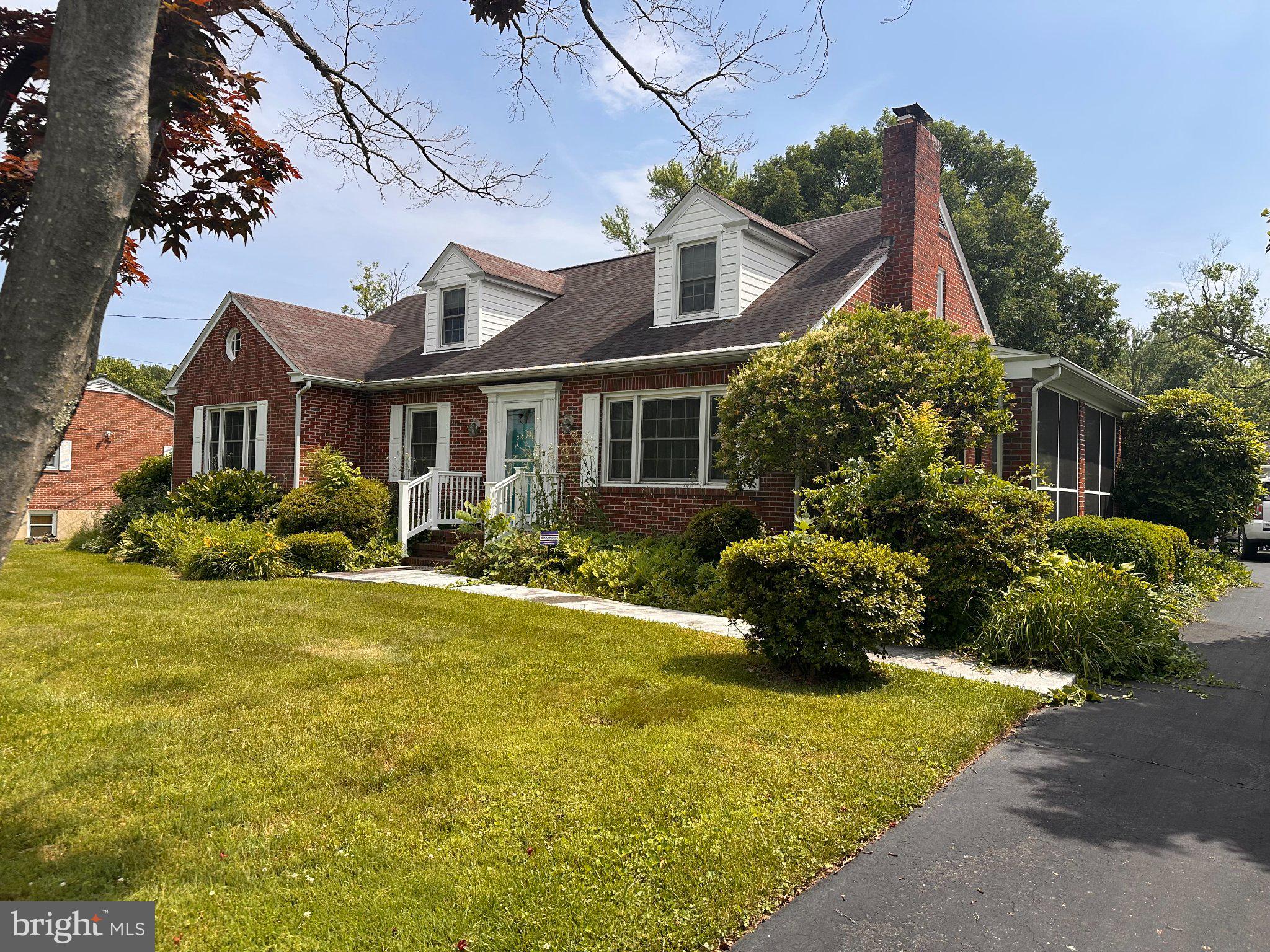 806 Long Bar Harbor Road Abingdon, MD 21009 - Photo 2 of 2 Charming brick home with lush greenery.