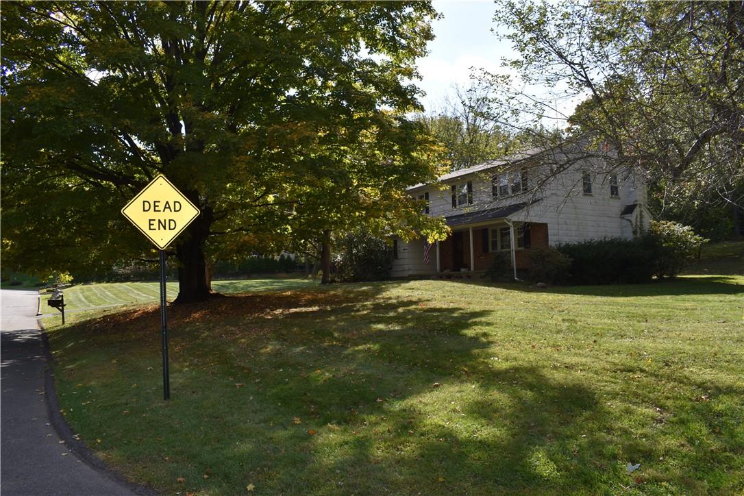 7 Harriet Lane Spring Valley, NY 10977 - Photo 1 of 1 a view of a house with yard and garage