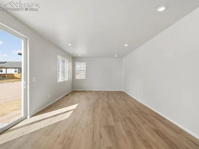 a view of an empty room and window