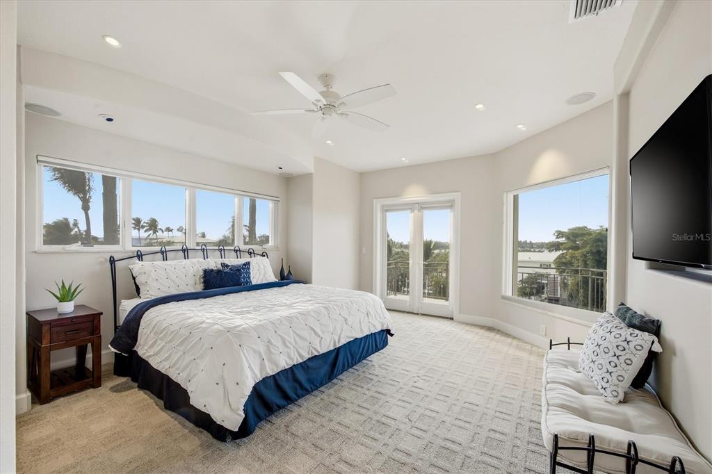 761 Norton Street Longboat Key, FL 34228 - Photo 43 of 66 a bedroom with a large bed and a large window