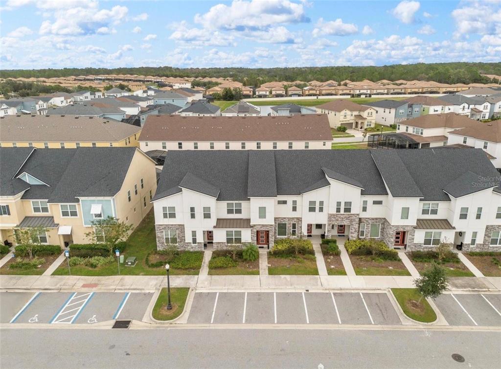 2163 Copper Bell Place Kissimmee, FL 34747 - Photo 2 of 41 a view of a city with lawn chairs