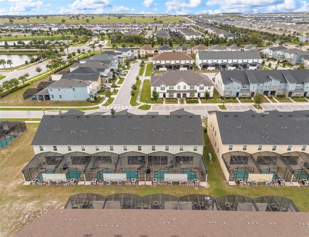 2163 Copper Bell Place Kissimmee, FL 34747 - Photo 3 of 41 an aerial view of residential houses with outdoor space