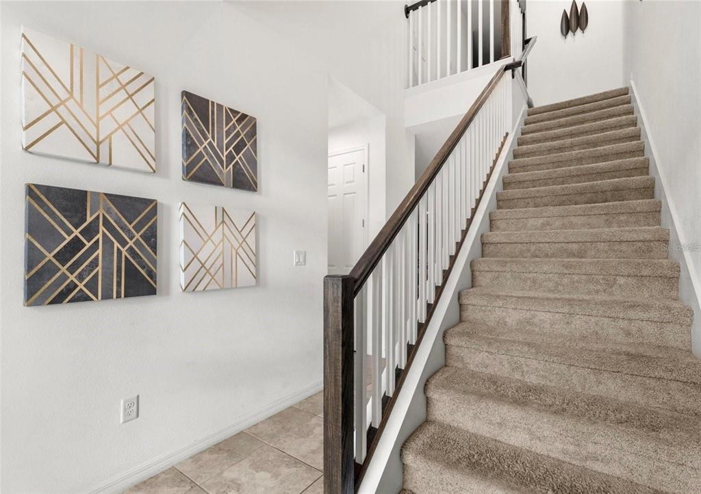 2163 Copper Bell Place Kissimmee, FL 34747 - Photo 8 of 41 a view of stairs