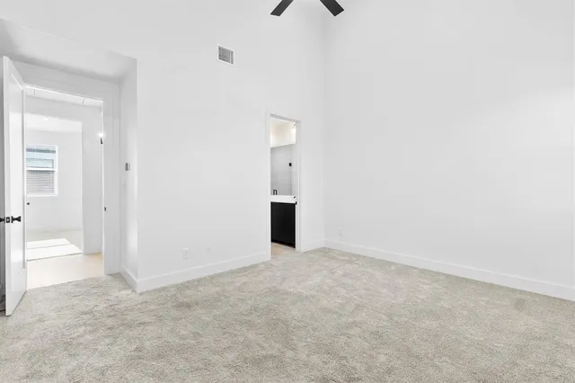 a view of an empty room with a bathroom