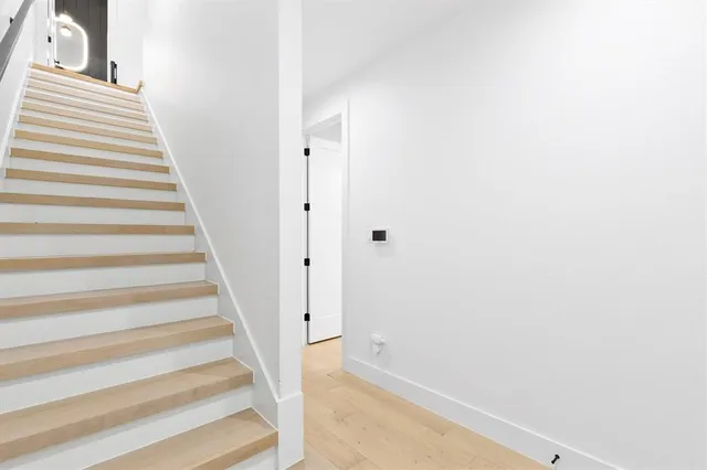 a view of staircase with white walls