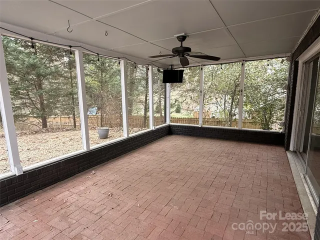 a view of lot of an empty room with a large window