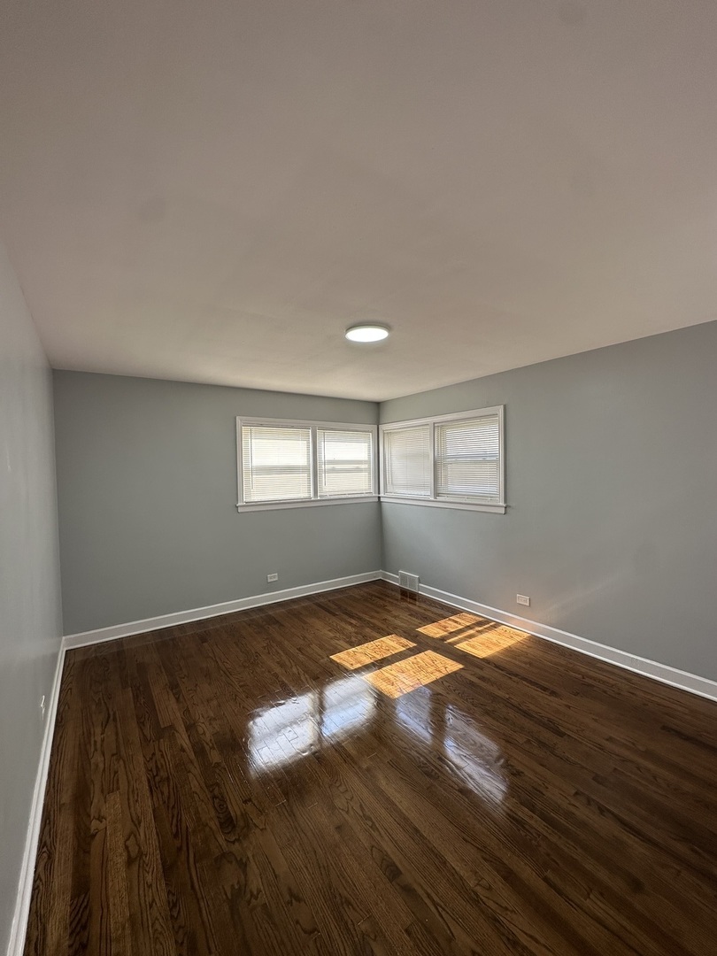 8232 Keating Avenue, Unit 1 Skokie, IL 60076 - Photo 13 of 21 a view of empty room with window