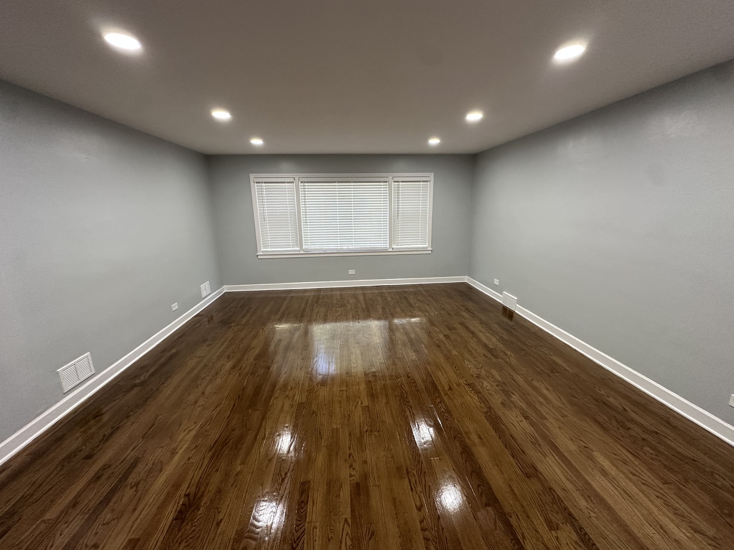 8232 Keating Avenue, Unit 1 Skokie, IL 60076 - Photo 2 of 21 a view of empty room with wooden floor