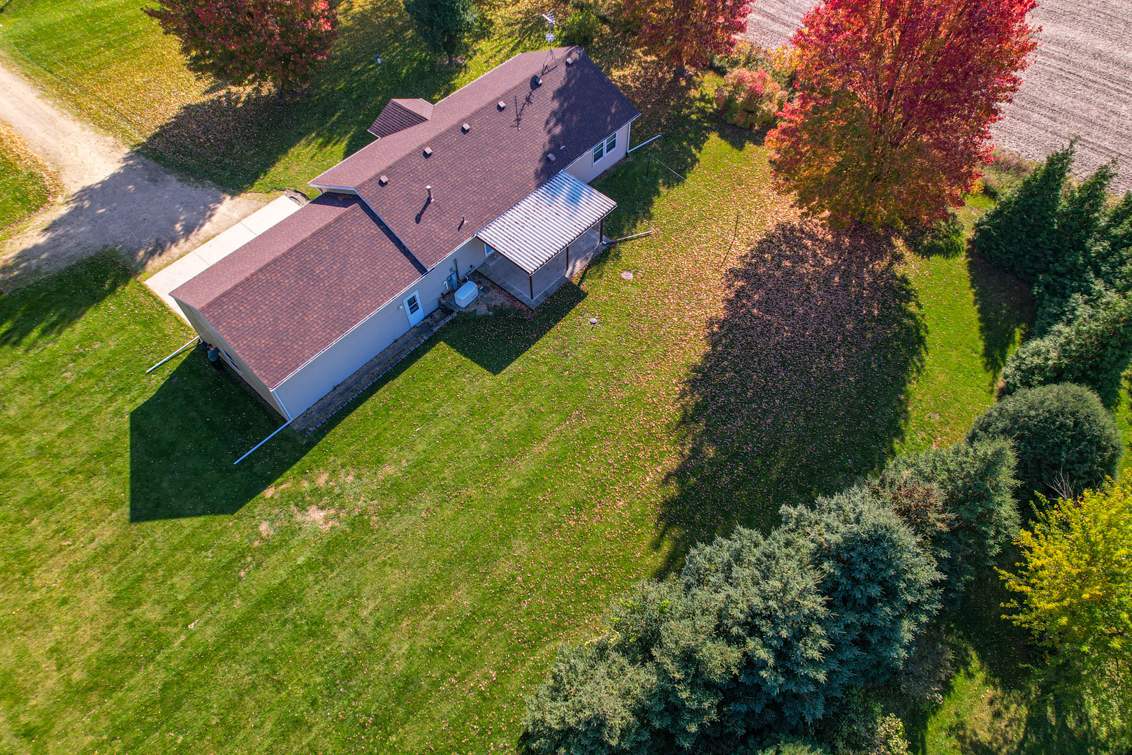 8752 Perryville Road Monroe Center, IL 61052 - Photo 11 of 41 an aerial view of house with yard swimming pool and outdoor seating