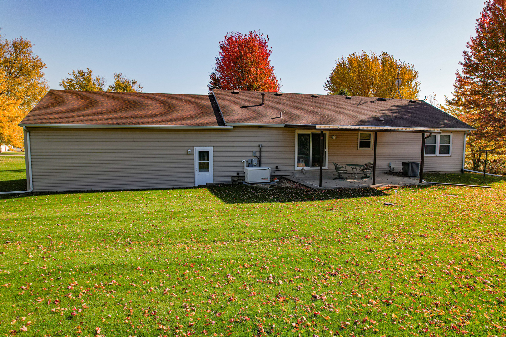8752 Perryville Road Monroe Center, IL 61052 - Photo 12 of 41 a front view of house with yard and seating area