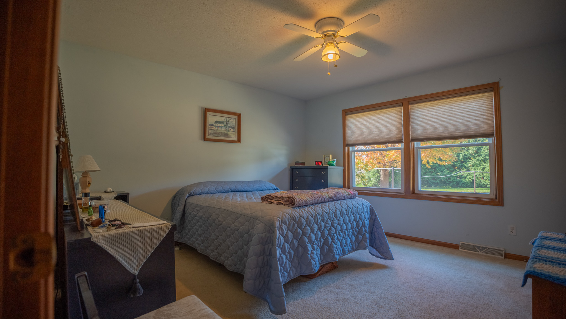 8752 Perryville Road Monroe Center, IL 61052 - Photo 29 of 41 a bedroom with a bed and a chandelier