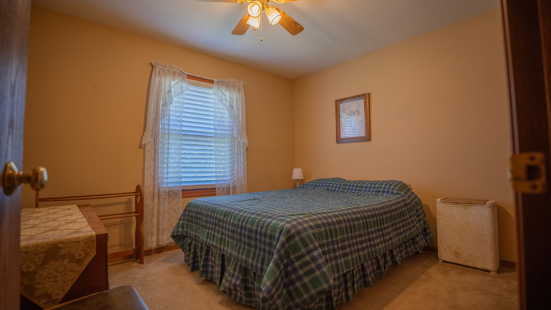 8752 Perryville Road Monroe Center, IL 61052 - Photo 31 of 41 a bedroom with a bed and a lamp on the dresser
