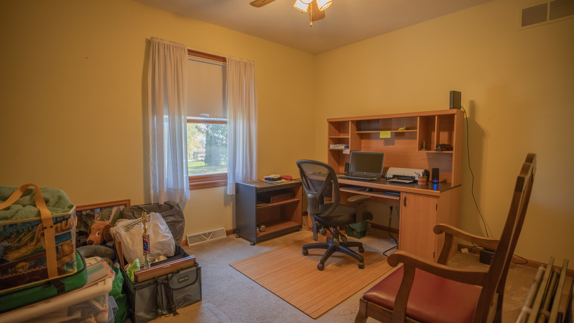 8752 Perryville Road Monroe Center, IL 61052 - Photo 32 of 41 a view of a workspace with furniture and a window