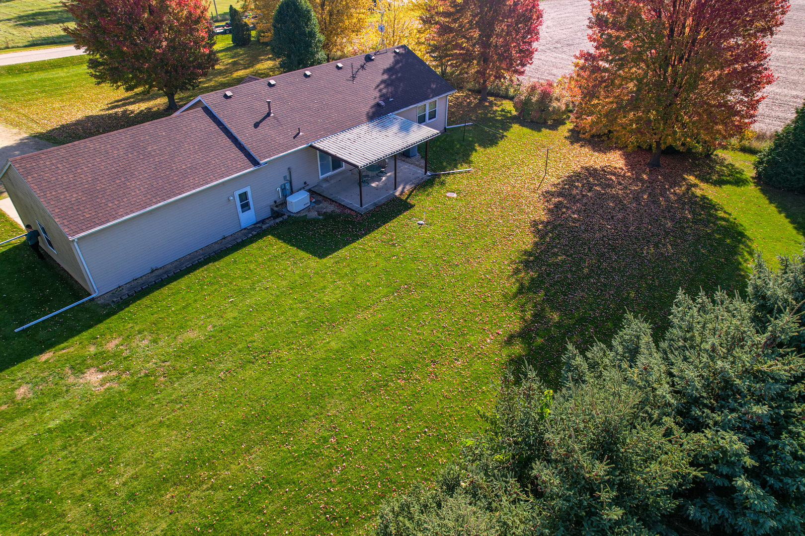 8752 Perryville Road Monroe Center, IL 61052 - Photo 10 of 41 a view of a house with a yard
