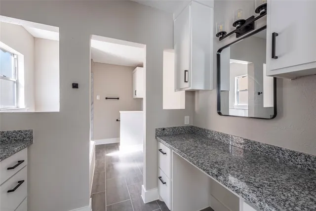 a view of a kitchen cabinets and a counter place