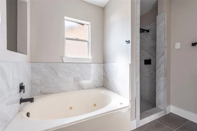 a white bath tub sitting next to a window