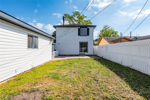 a house view with a backyard space
