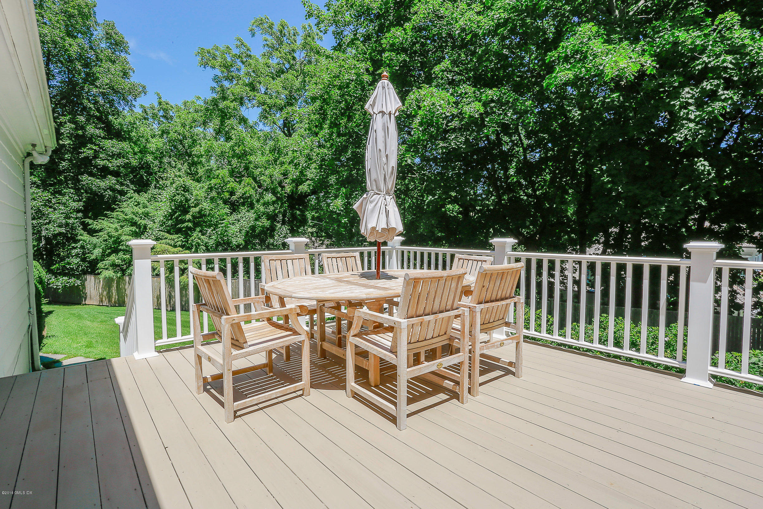 18 Dingletown Road Greenwich, CT 06830 - Photo 16 of 21 a view of a deck with furniture and garden