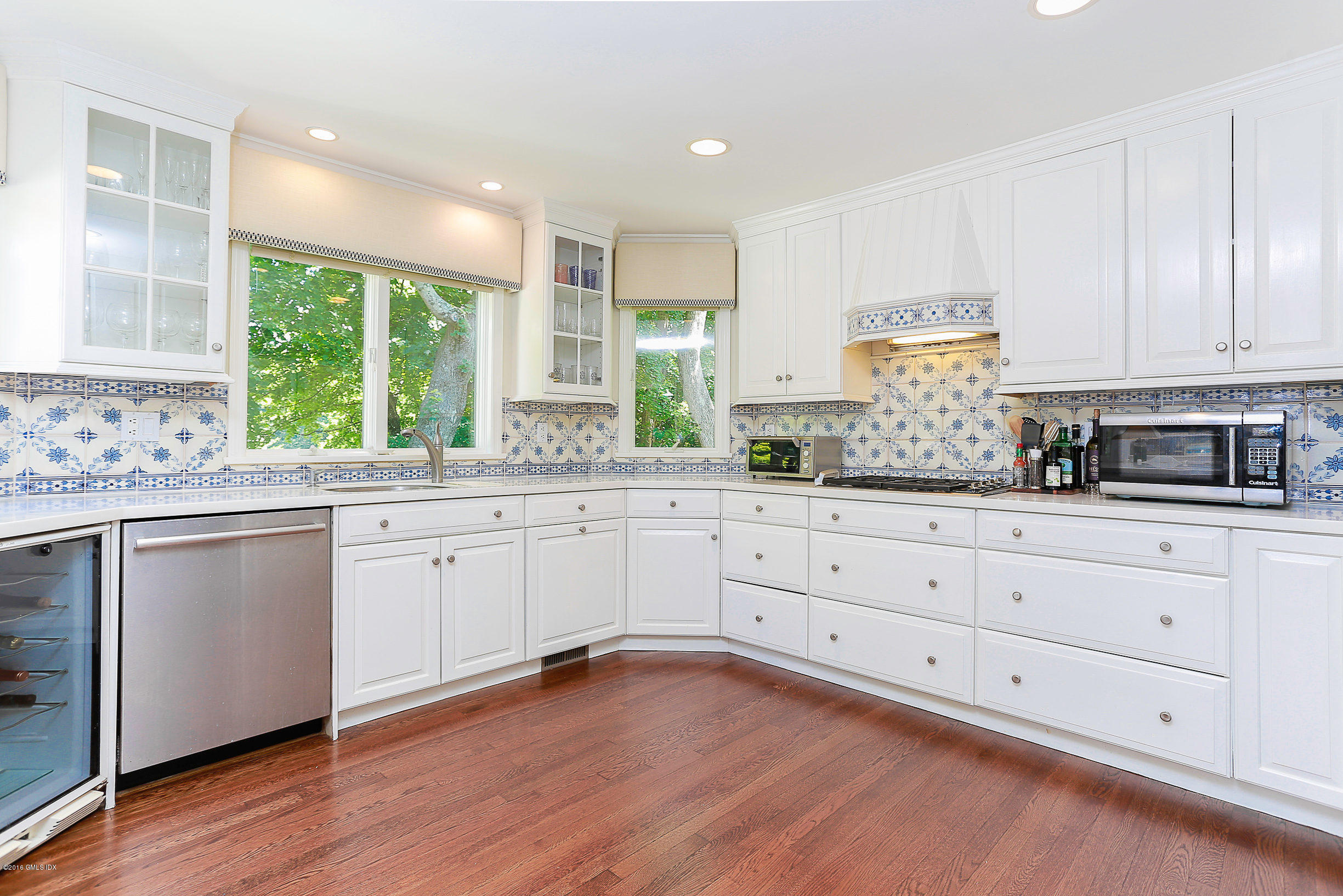 18 Dingletown Road Greenwich, CT 06830 - Photo 4 of 21 a kitchen with granite countertop white cabinets and window