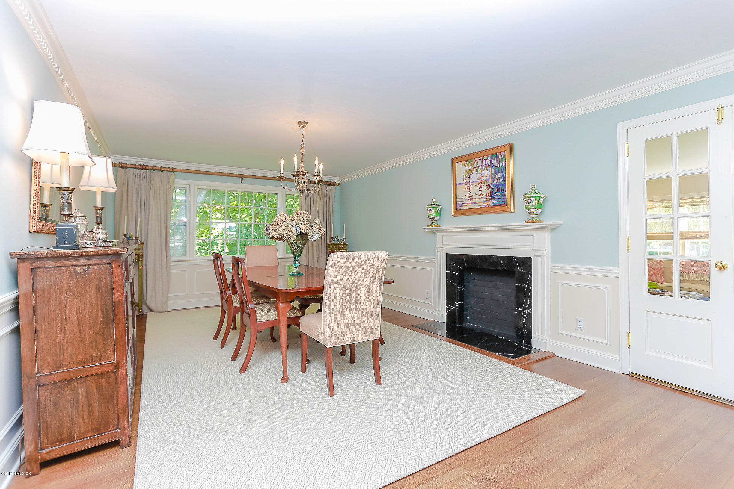 18 Dingletown Road Greenwich, CT 06830 - Photo 5 of 21 a dining room with furniture a fireplace and wooden floor