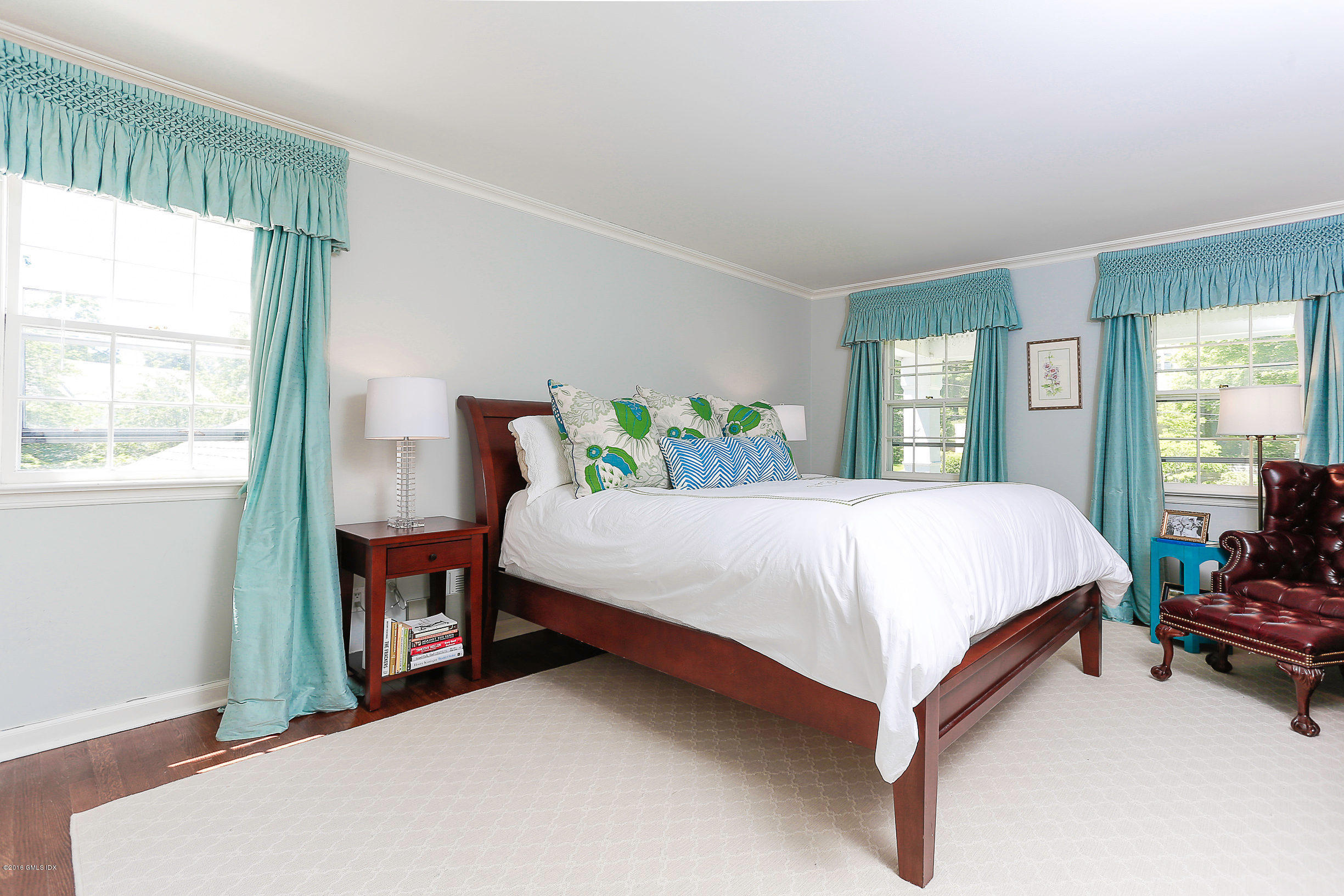 18 Dingletown Road Greenwich, CT 06830 - Photo 9 of 21 a bed sitting in a bedroom next to a window