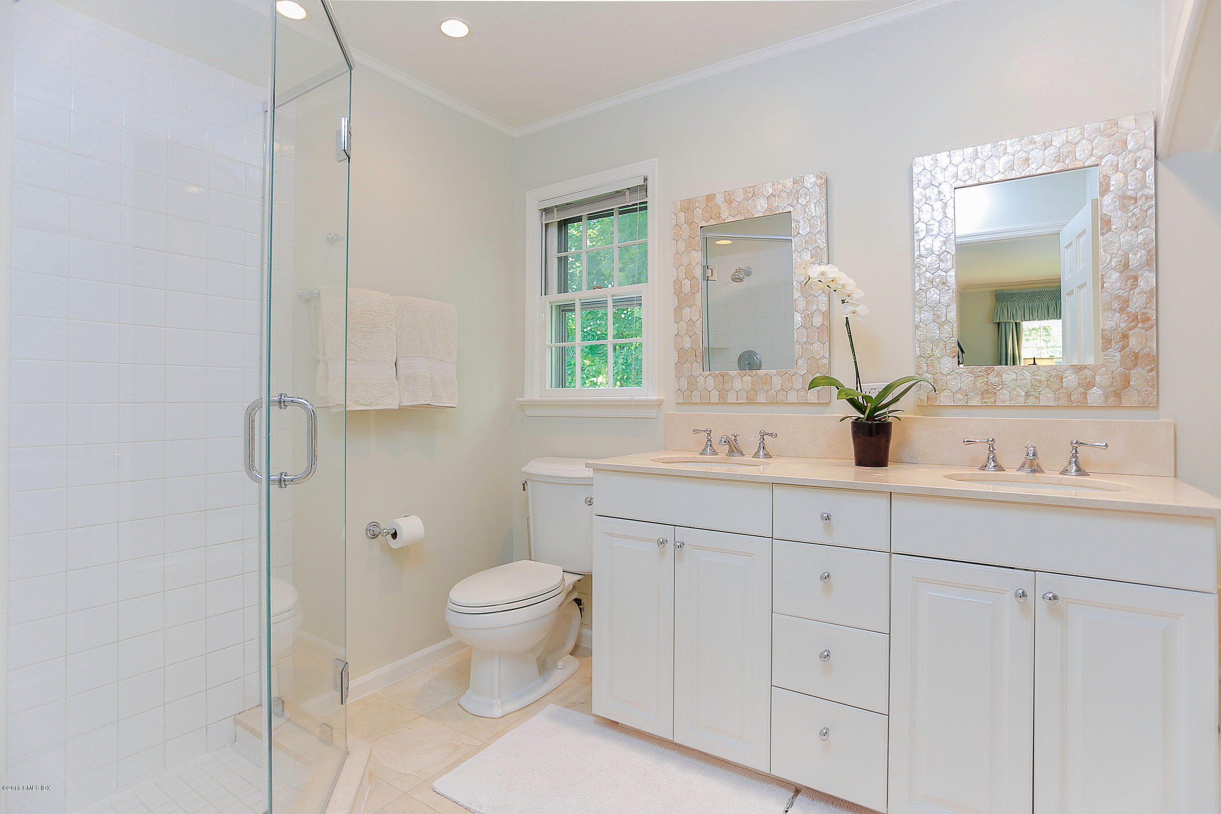 18 Dingletown Road Greenwich, CT 06830 - Photo 10 of 21 a bathroom with a double vanity sink toilet and a mirror