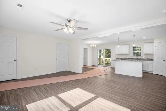 a view of a park with large trees