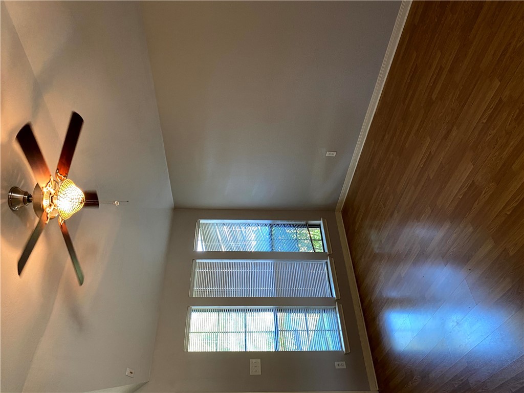 2018 Snowy Brook Trail Bryan, TX 77807 - Photo 7 of 9 a view of an empty room with wooden floor and a window
