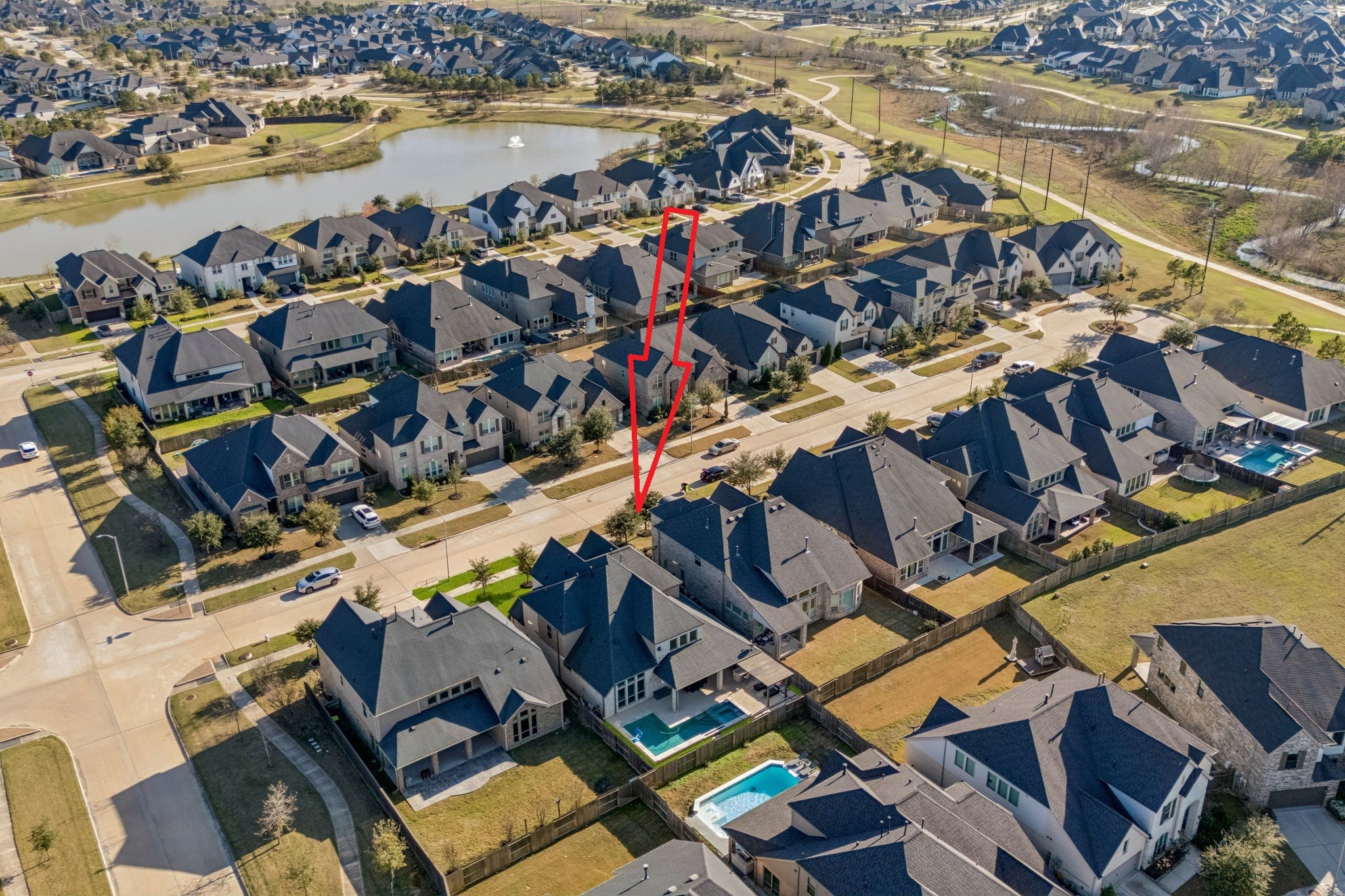 28706 Casen Ranch Lane Fulshear, TX 77441 - Photo 26 of 31 Experience the beauty of Cross Creek Ranch from above, highlighting the home's proximity to scenic community lakes and walking trails.