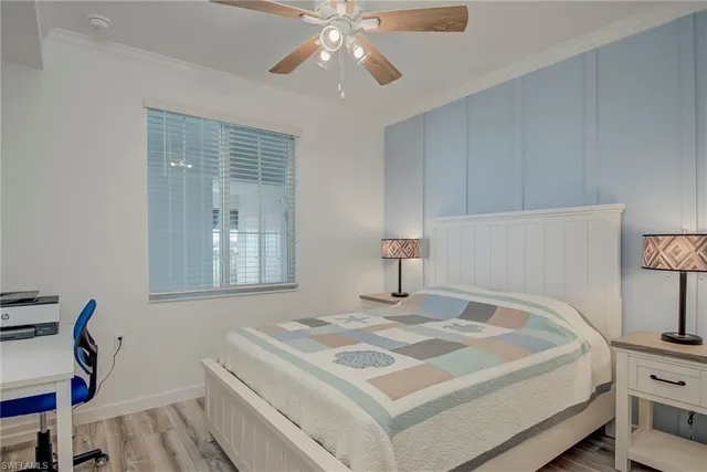 a bedroom with a bed and a night stand