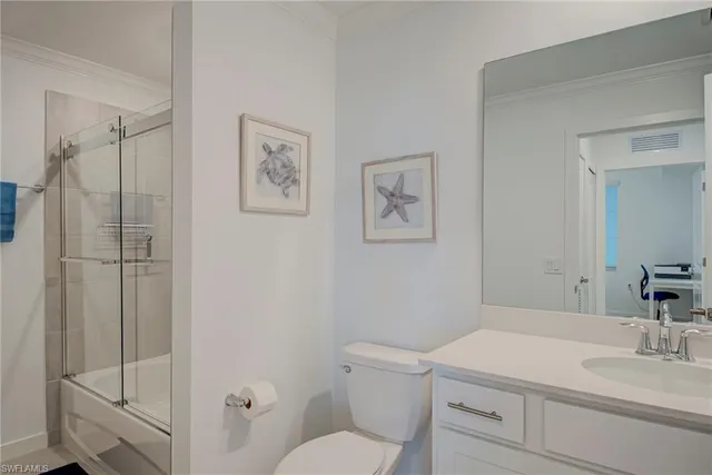a bathroom with a sink toilet and vanity