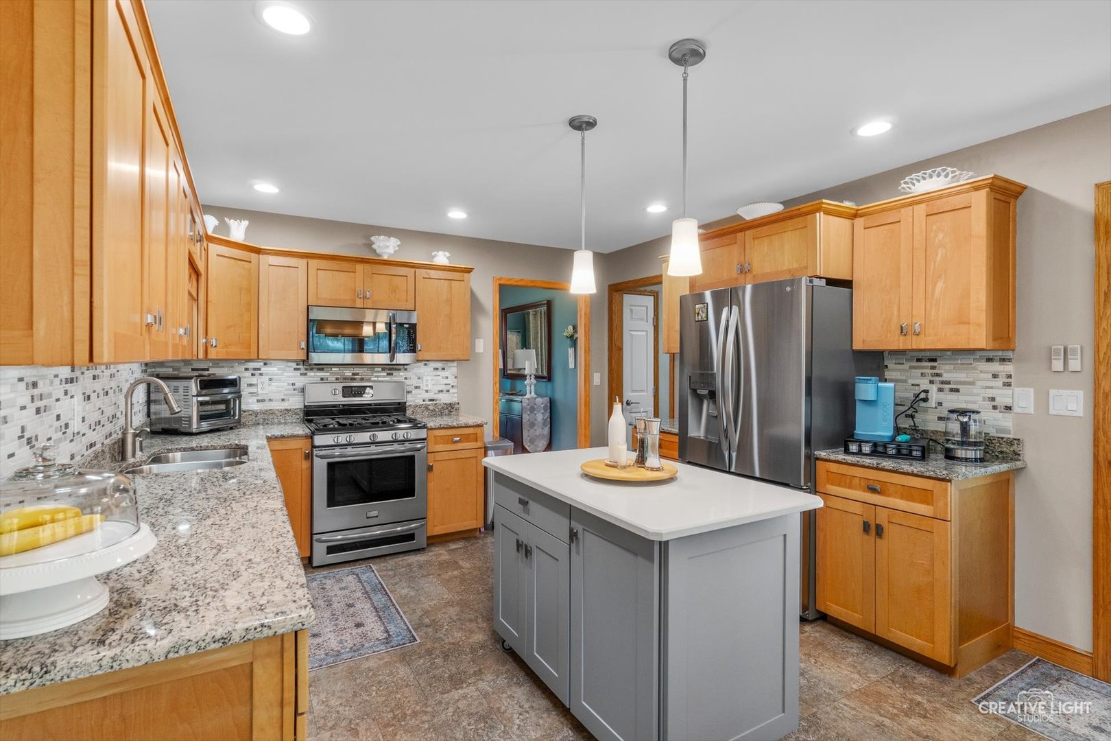 14050 Townhouse Road Newark, IL 60541 - Photo 10 of 45 a kitchen with stainless steel appliances granite countertop a sink stove and refrigerator
