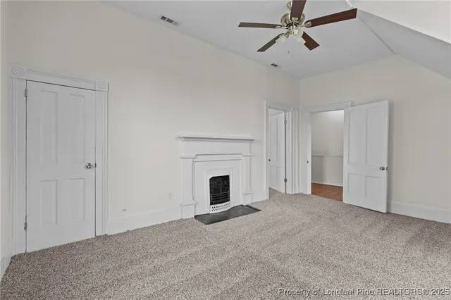 a view of empty room with fan