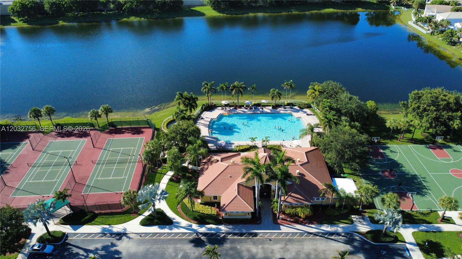 4331 Southwest 124th Way Miramar, FL 33027 - Photo 38 of 40 an aerial view of a house with a yard and lake view