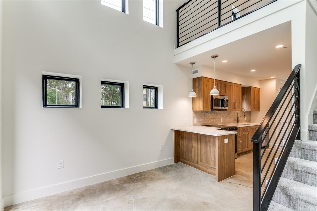4715 Live Oak Street, Unit 102 Dallas, TX 75204 - Photo 11 of 18 a view of a hallway with workspace and a window