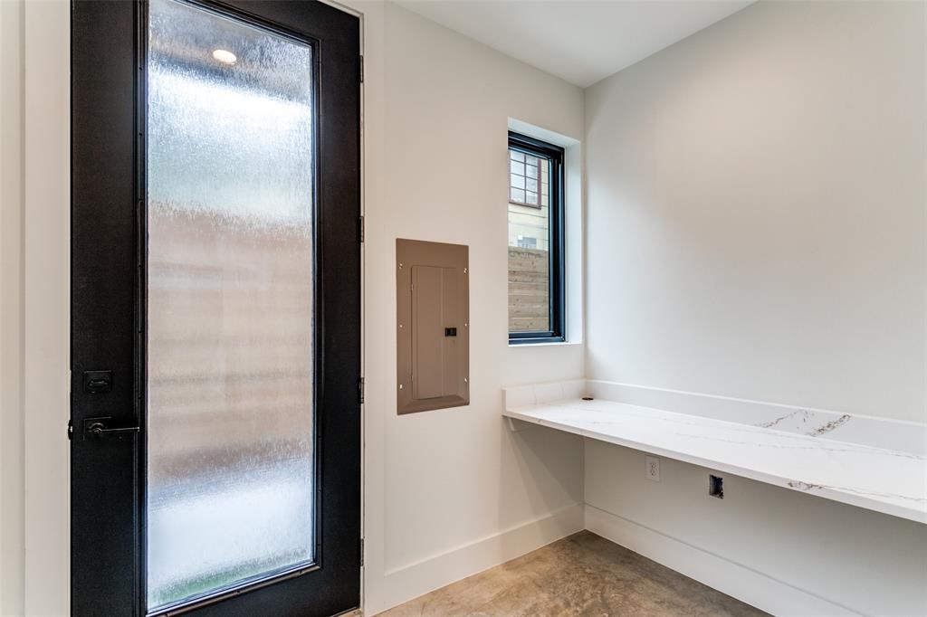 4715 Live Oak Street, Unit 102 Dallas, TX 75204 - Photo 13 of 18 a bathroom with a double vanity sink and a mirror