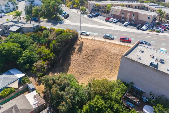 an aerial view of residential houses with outdoor space