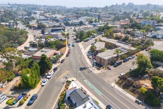 an aerial view of a city with streets and houses