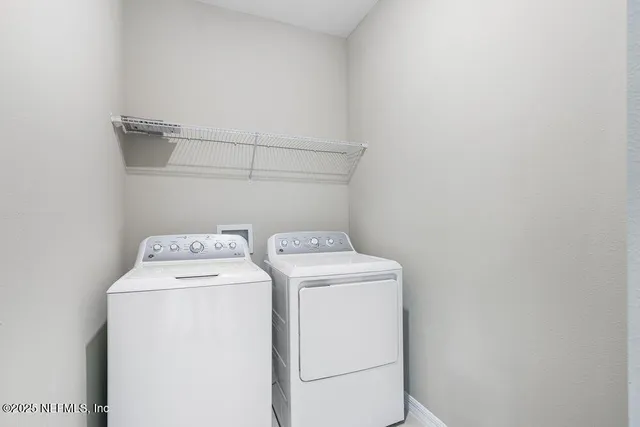 a utility room with dryer and washer