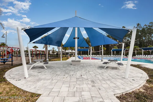 a view of a swimming pool and outdoor space