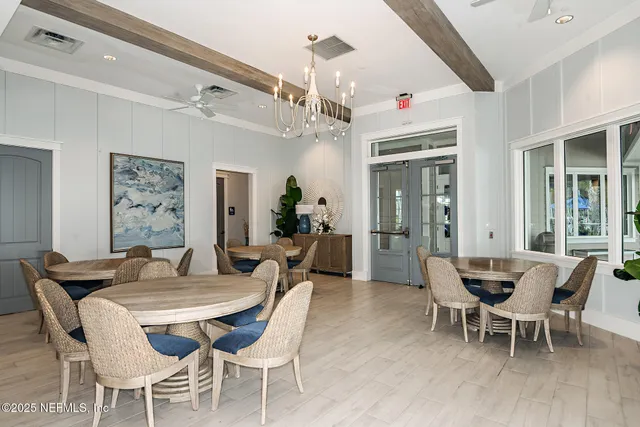 a kitchen with a table and chairs