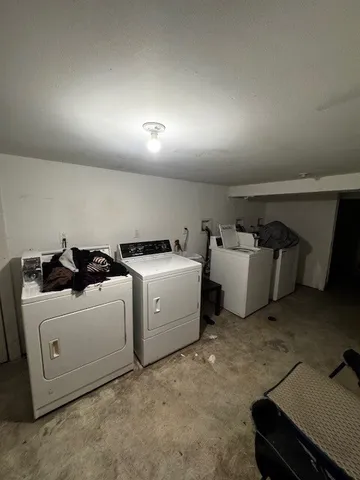 a utility room with furniture and a projector screen